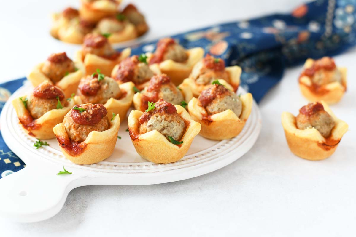 Meatball Bites with Crescent Dough on a white tray. 