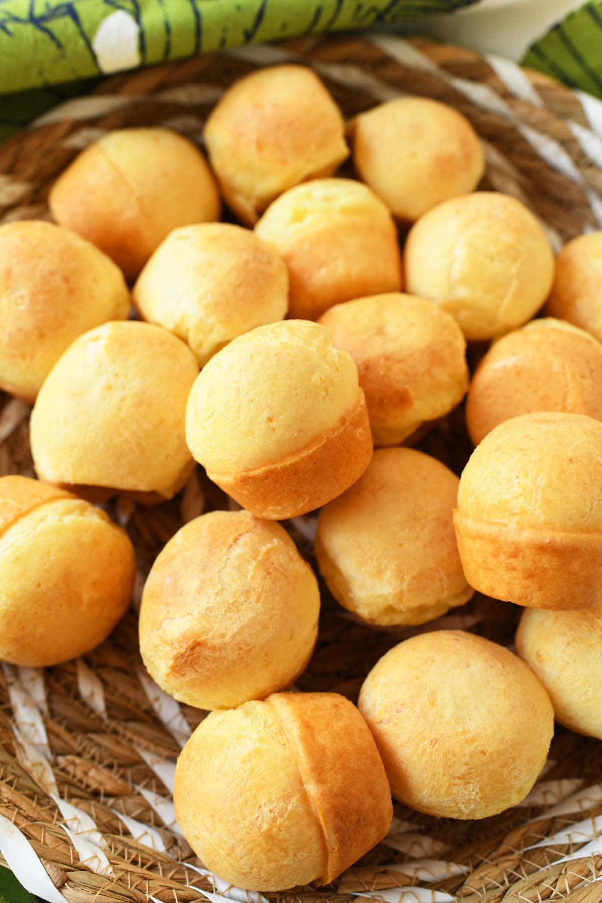 A basket of golden brown Brazilian cheesebread.